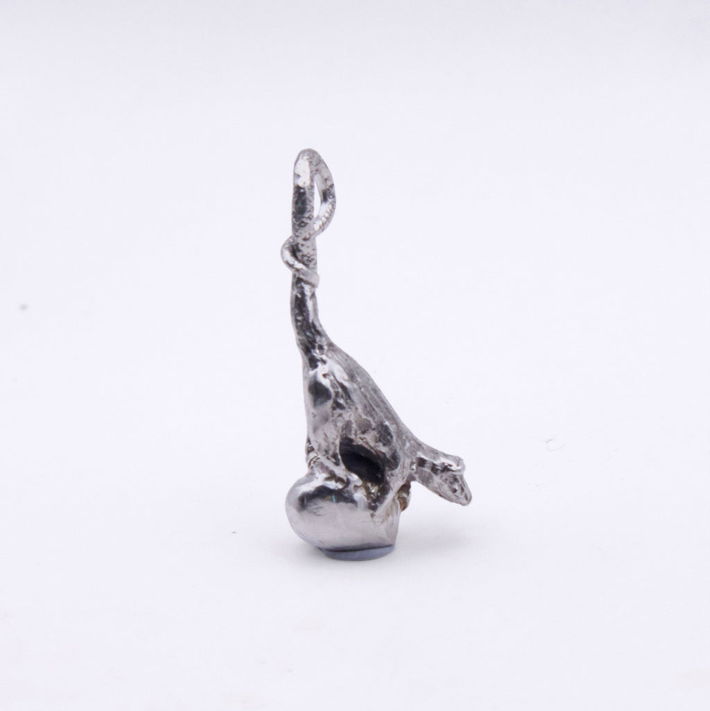 A small silver-toned metal charm shaped like a stylized rat with a loop at the top, photographed on a plain white background.