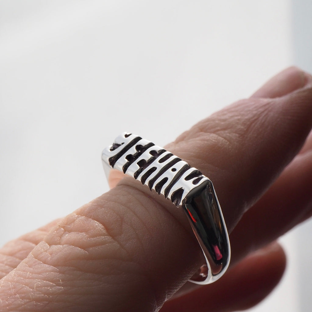Silver signet ring hand carved on top with the word "YEEHAW".