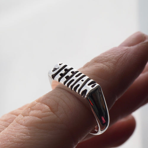 Silver signet ring hand carved on top with the word "YEEHAW".